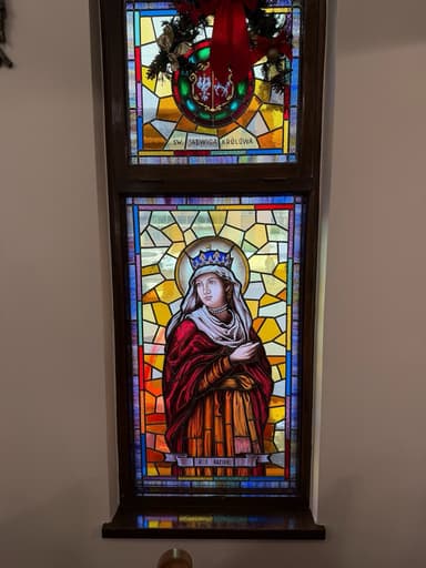 Stained glass window of St. Hedwig Queen of Poland in royal regalia